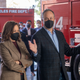 Second gentleman Douglas Emhoff, right, wearing a face mask accompanied by Vice President Kamala Harris speaks with firefighters while visiting the Los Angeles Fire Department Station 94, in Los Angeles, Friday, Dec. 24, 2021.